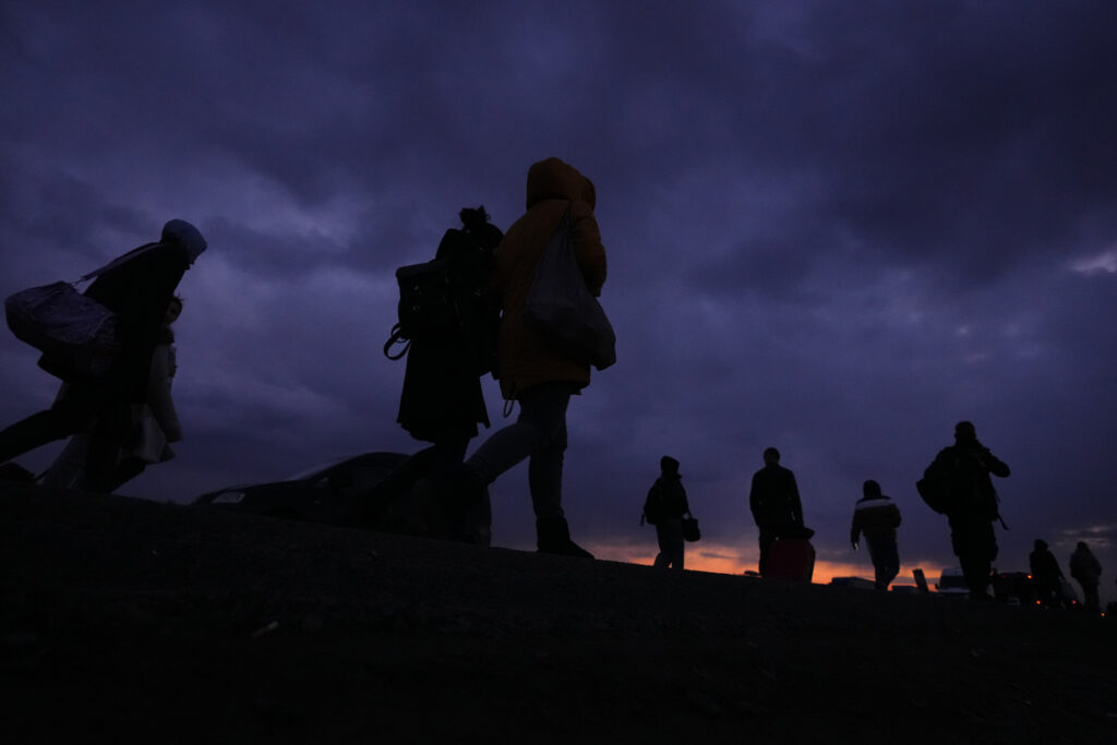 Refugees fleeing conflict in neighboring Ukraine arrive to Przemysl, Poland, Saturday, Feb. 26, 2022. (AP Photo/Petr David Josek)